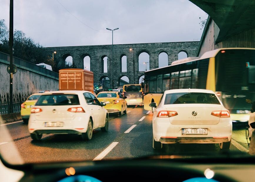 rush hour traffic under aqueduct bridge